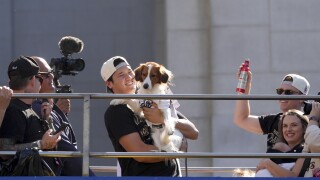 Los Angeles Dodgers' Shohei Ohtani holds his dog Decoy during the Los Angeles Dodgers baseball World Series championship parade 